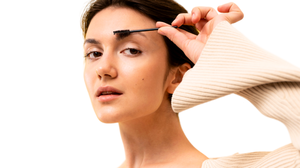 A model applying eyebrow oil